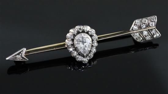 A late Victorian gold and diamond set arrow shaped bar brooch, 56mm.